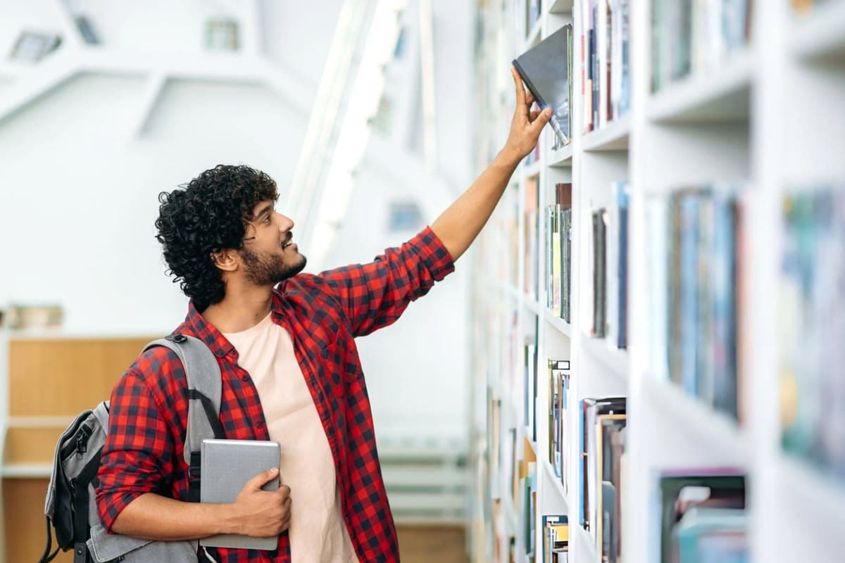 Reaching for a book on a shelf
